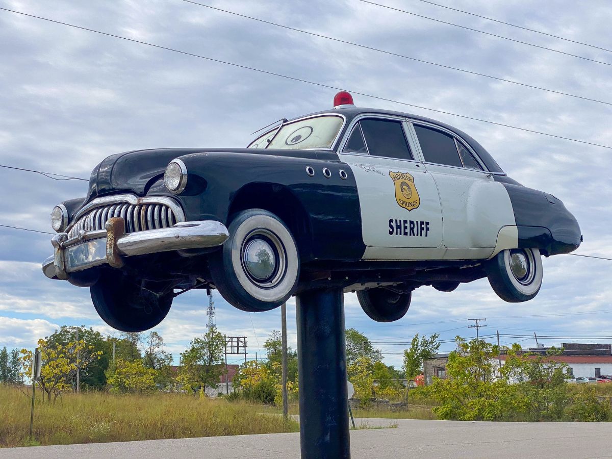 Sheriff Car from the Disney and Pixar film Cars in Kansas on Route 66. The car has been signed by Michael Wallis who is a Route 66 expert and also voices the character
