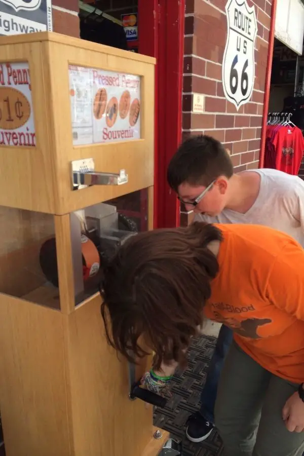Children getting a pressed penny at Seligman on Route 66