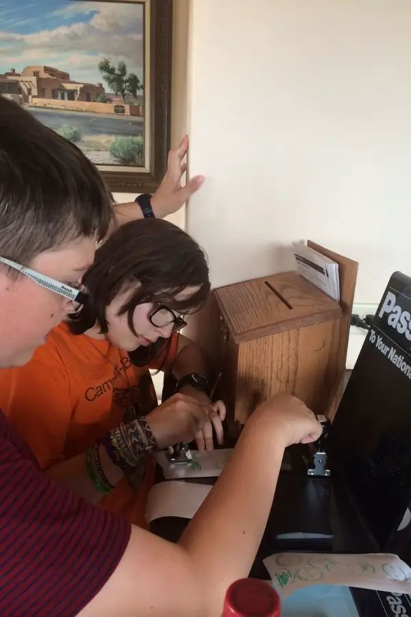 kids collecting stamps at the Petrified Forest National Park on Route 66