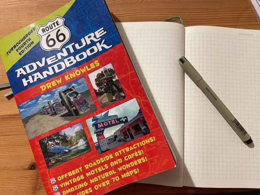 Route 66 guide book and notepad for planning