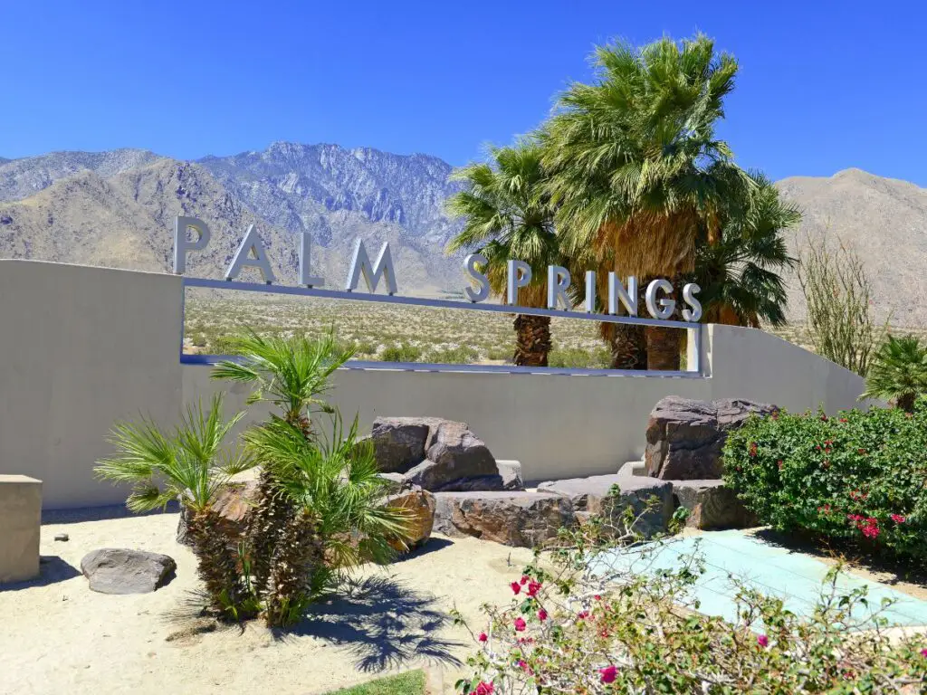 Sign at Palm Springs with mountains in background